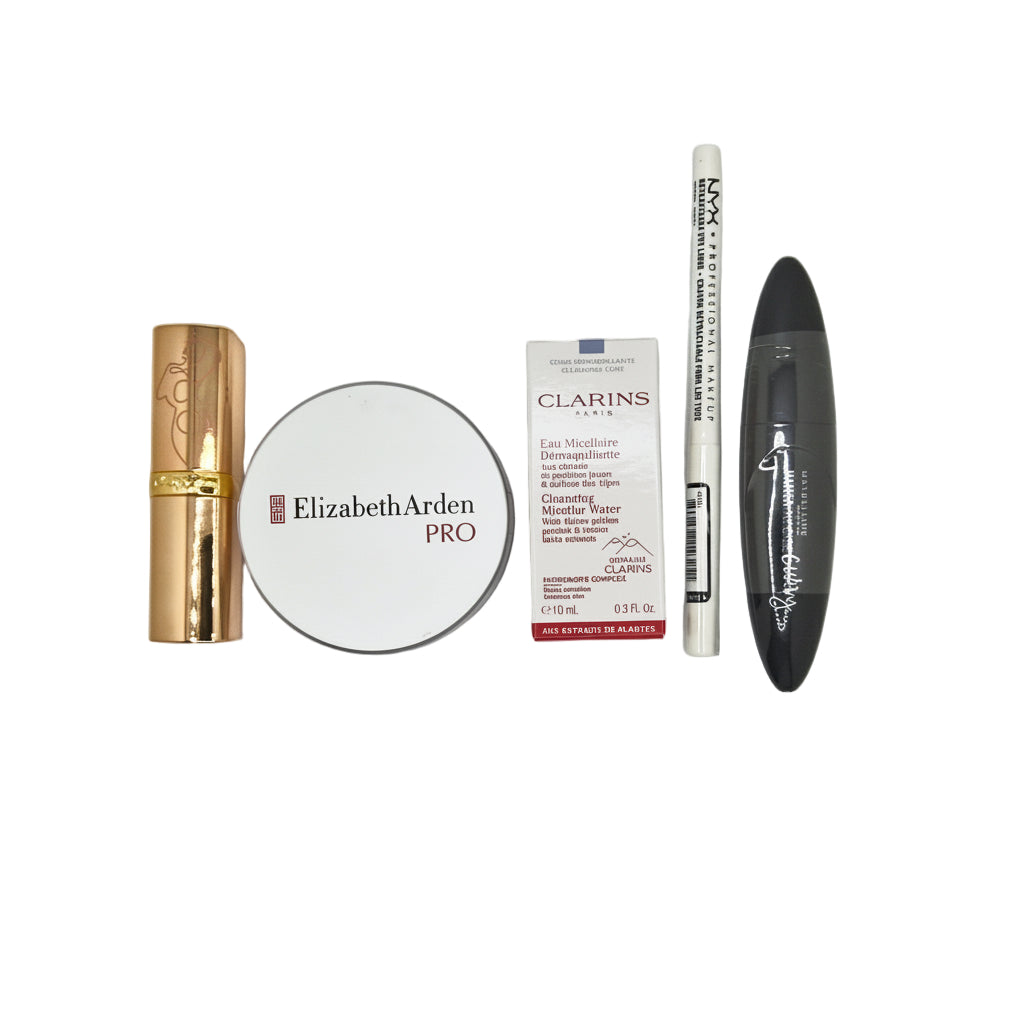 Collection of skincare and makeup products including Elizabeth Arden, Clarins, and NYX on a gray background.