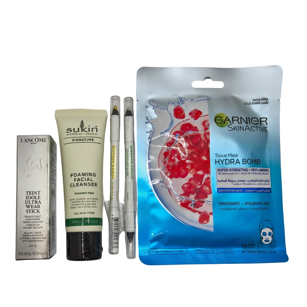 Collection of skincare products including a tube, box, and face mask on a gray background